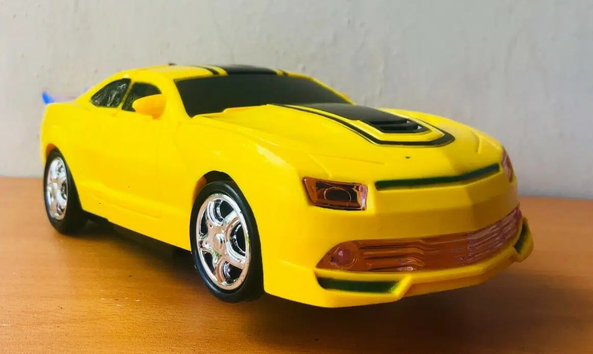 Uttam Toys Robot To Car Converting Transformer Toy with Light and Sound for Kids (Yellow)
