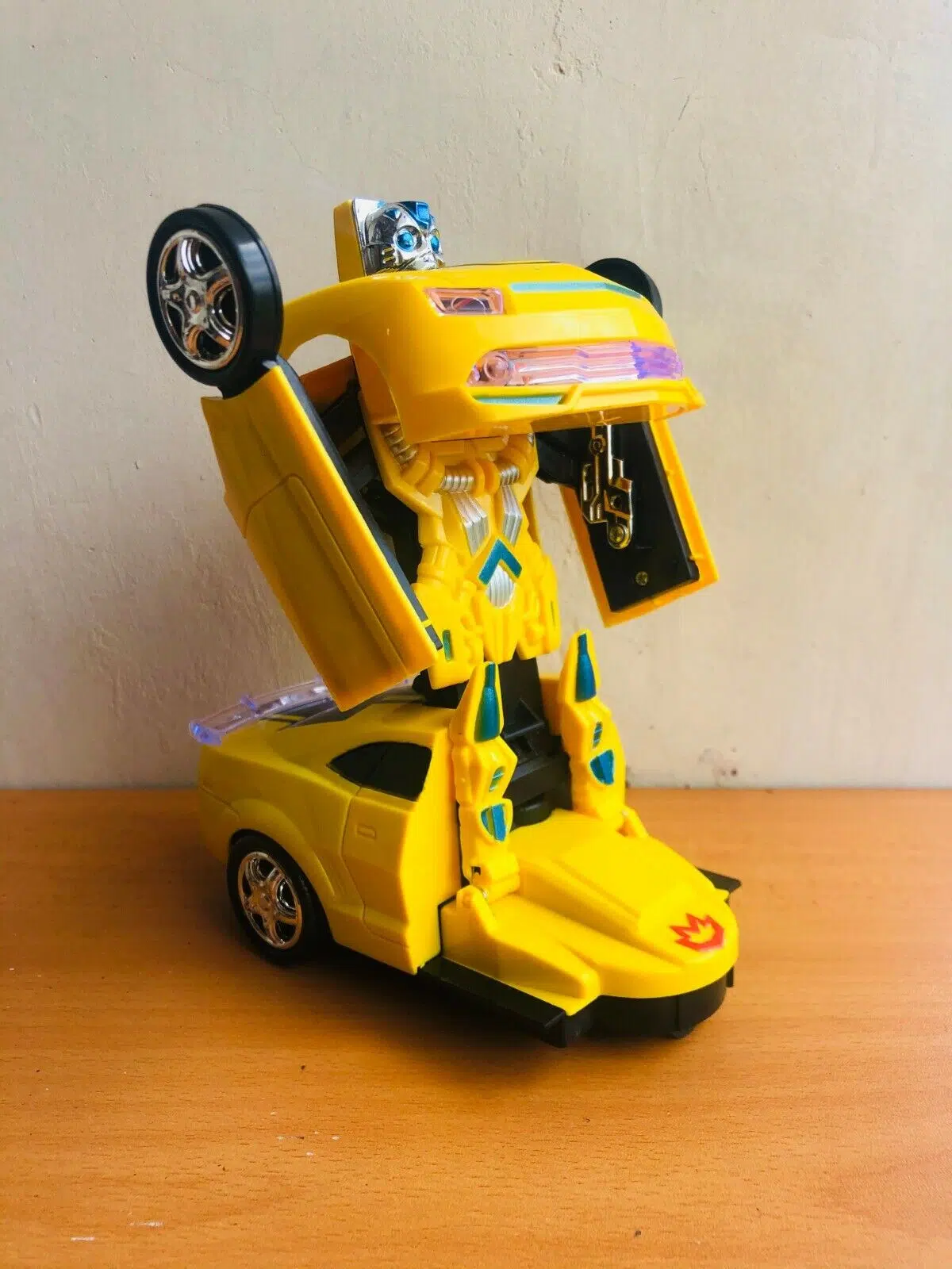 Uttam Toys Robot To Car Converting Transformer Toy with Light and Sound for Kids (Yellow)